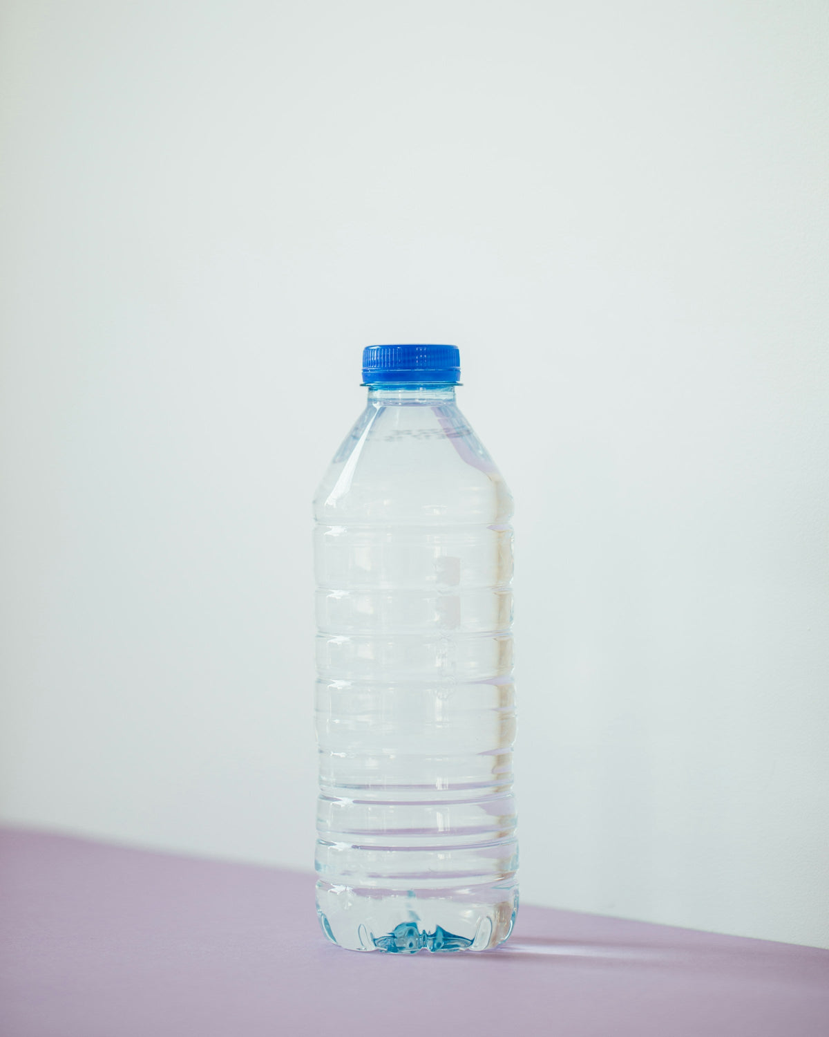 Clear empty PET bottle ready for custom labelling and manufacturing